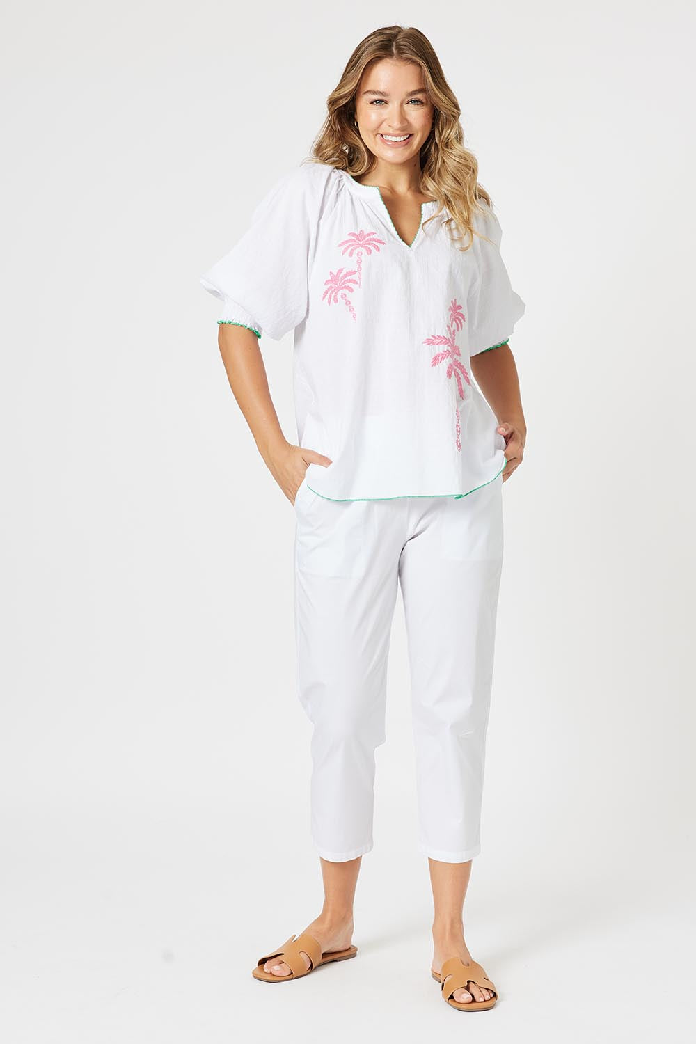 A model wearing the Pina Colada Embroidered Cotton Top in colour White (White), from the front, showing the whole outfit