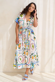 Model Tahnee wearing size S of the Amalfi Linen Blend Dress in colour Bluemulti, from the front, showing the whole outfit