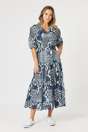 A model wearing the Calabasas Cotton Dress in colour Navy (Blue), from the front, showing the whole outfit