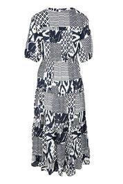 Product shot of the Calabasas Cotton Dress in colour Navy (Blue), from the back