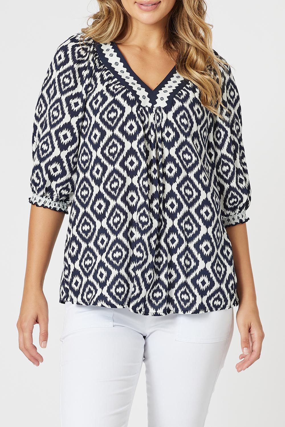 A model wearing the Diamonds Are Forever Top in colour Navy (Blue), from the front, cropped image
