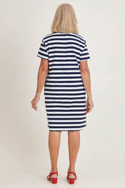 Model Sandy wearing size S of the Red Bow Stripe Cotton Dress in colour Navy (Blue), from the back
