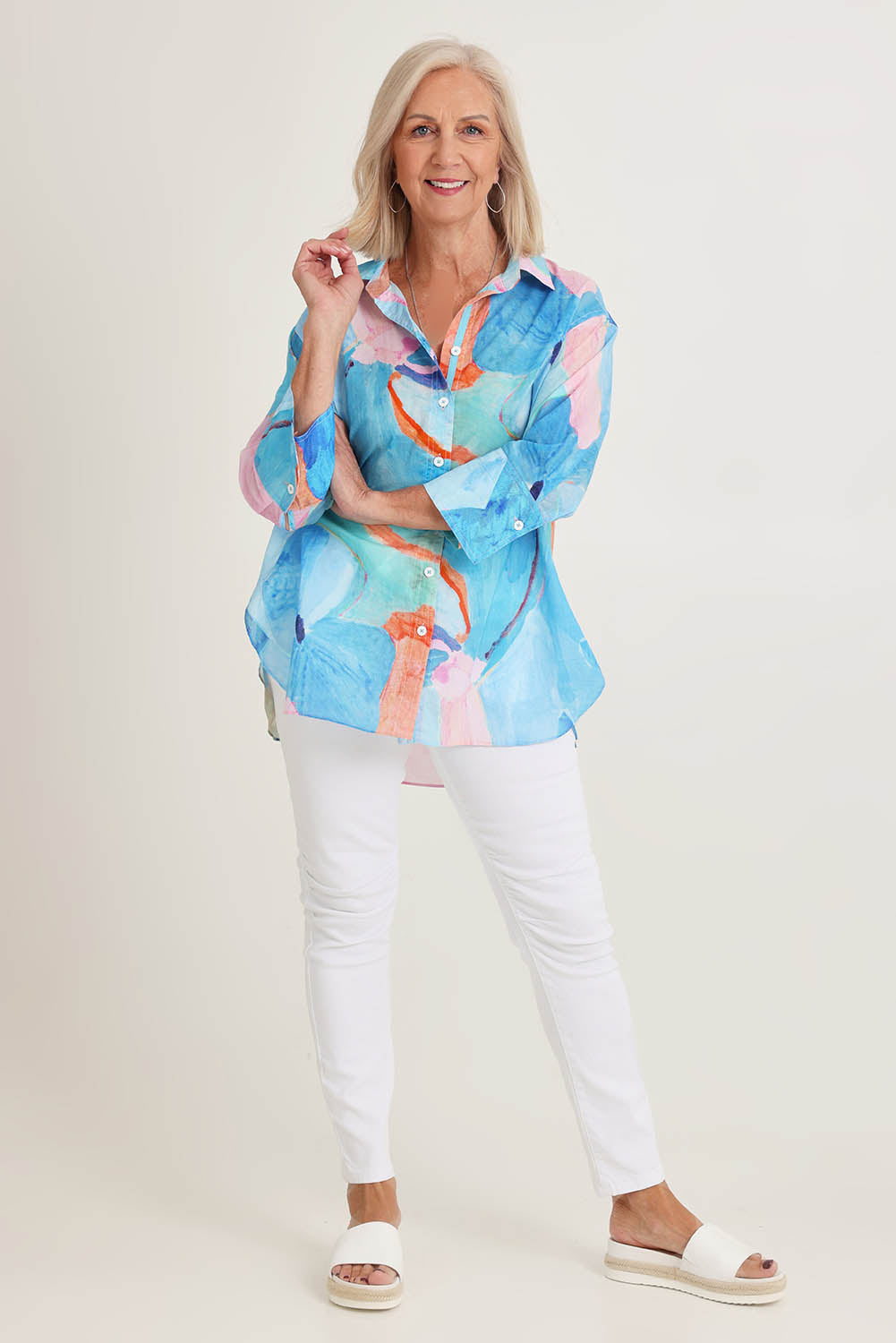 Model Sandy wearing size S of the Grazia Mio Caro Cotton Shirt in colour Blue (Blue), from the front, showing the whole outfit