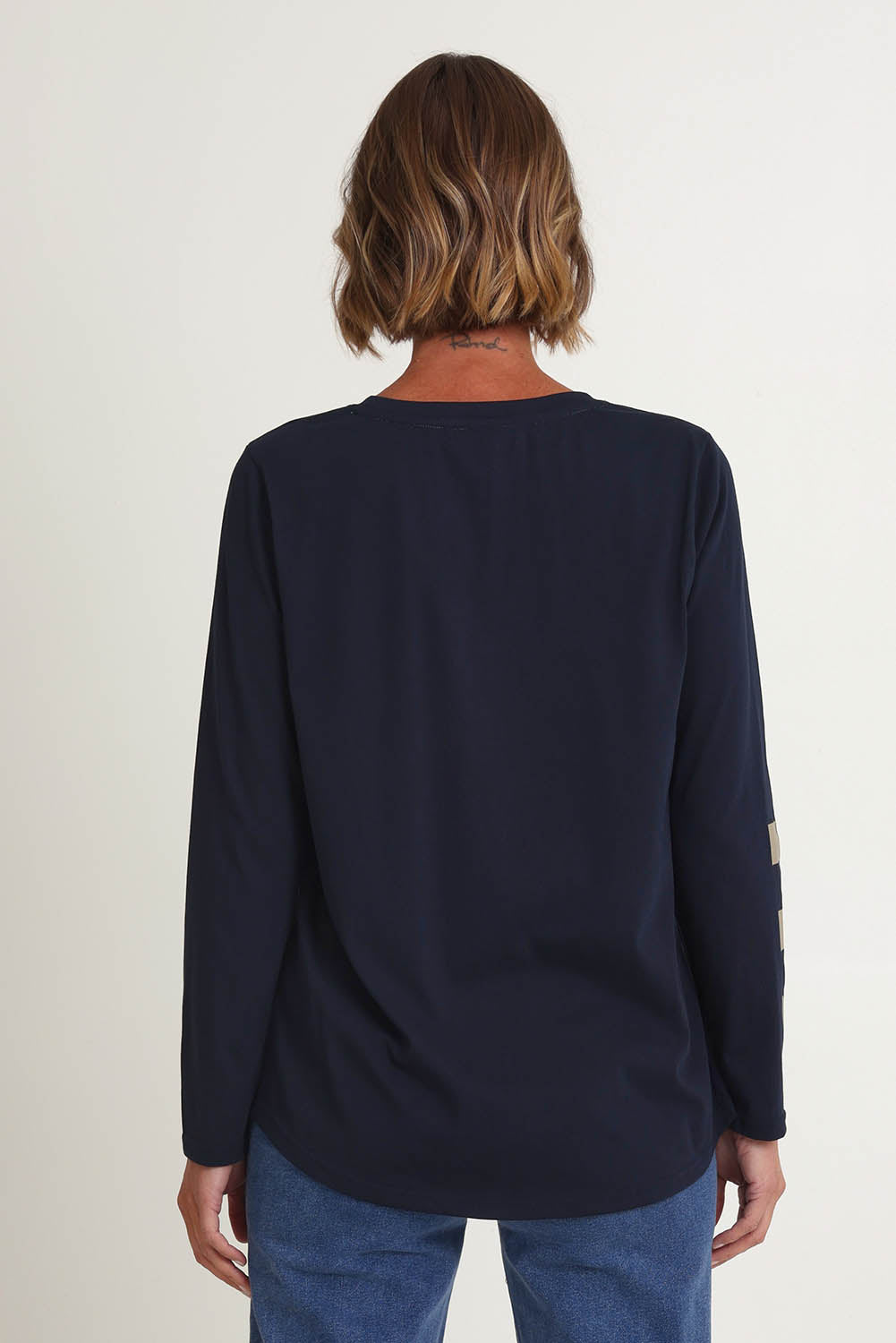 Model Riina wearing size S of the Heart Square Tee in colour Navy (Blue), from the back