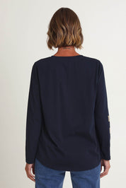 Model Riina wearing size S of the Heart Square Tee in colour Navy (Blue), from the back