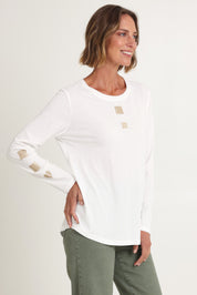 Model Riina wearing size S of the Heart Square Tee in colour White (White), from the front, cropped image