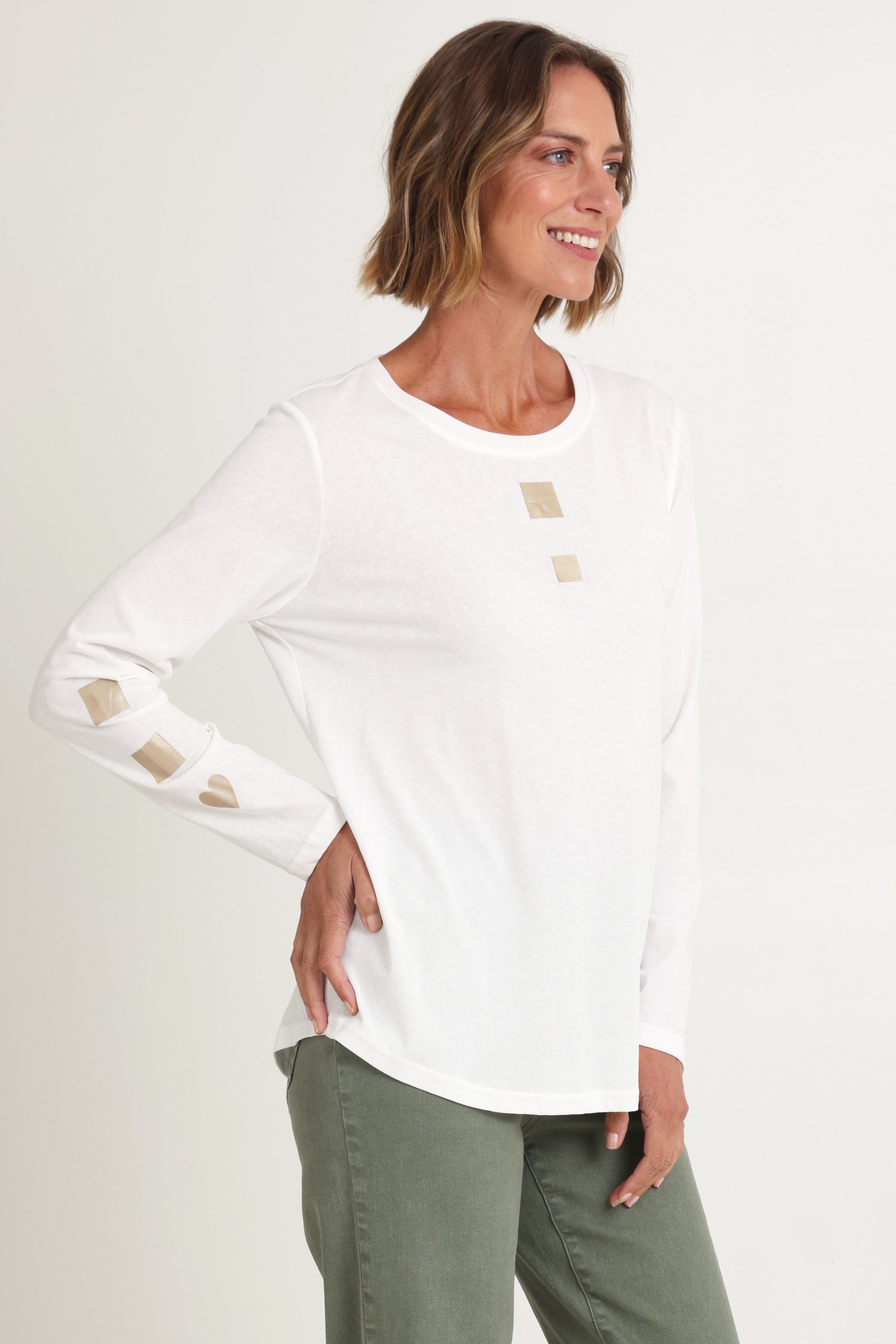 Model Riina wearing size S of the Heart Square Tee in colour White (White), from the front, cropped image