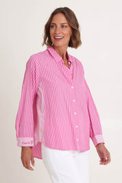 Model Riina wearing size S of the Cabo Stripe Shirt in colour Pink (Pink), from the front, cropped image