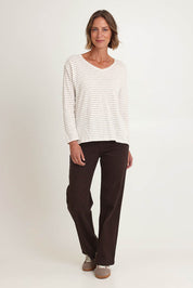 Model Riina wearing size S of the City Stripe Tee in colour Naturivory, from the front, showing the whole outfit