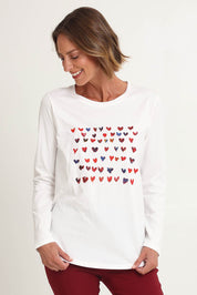 Model Riina wearing size S of the Sweetheart Tee in colour Ivory (White), from the front, cropped image