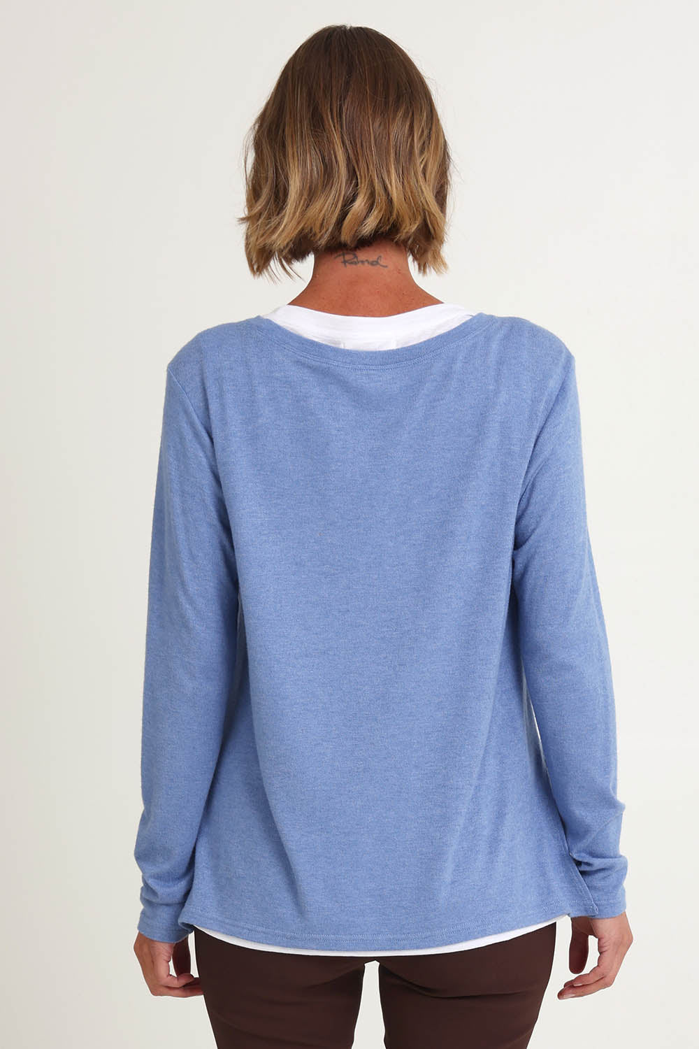 Model Riina wearing size S of the Alicia 2 In 1 Top in colour Blue (Blue), from the back