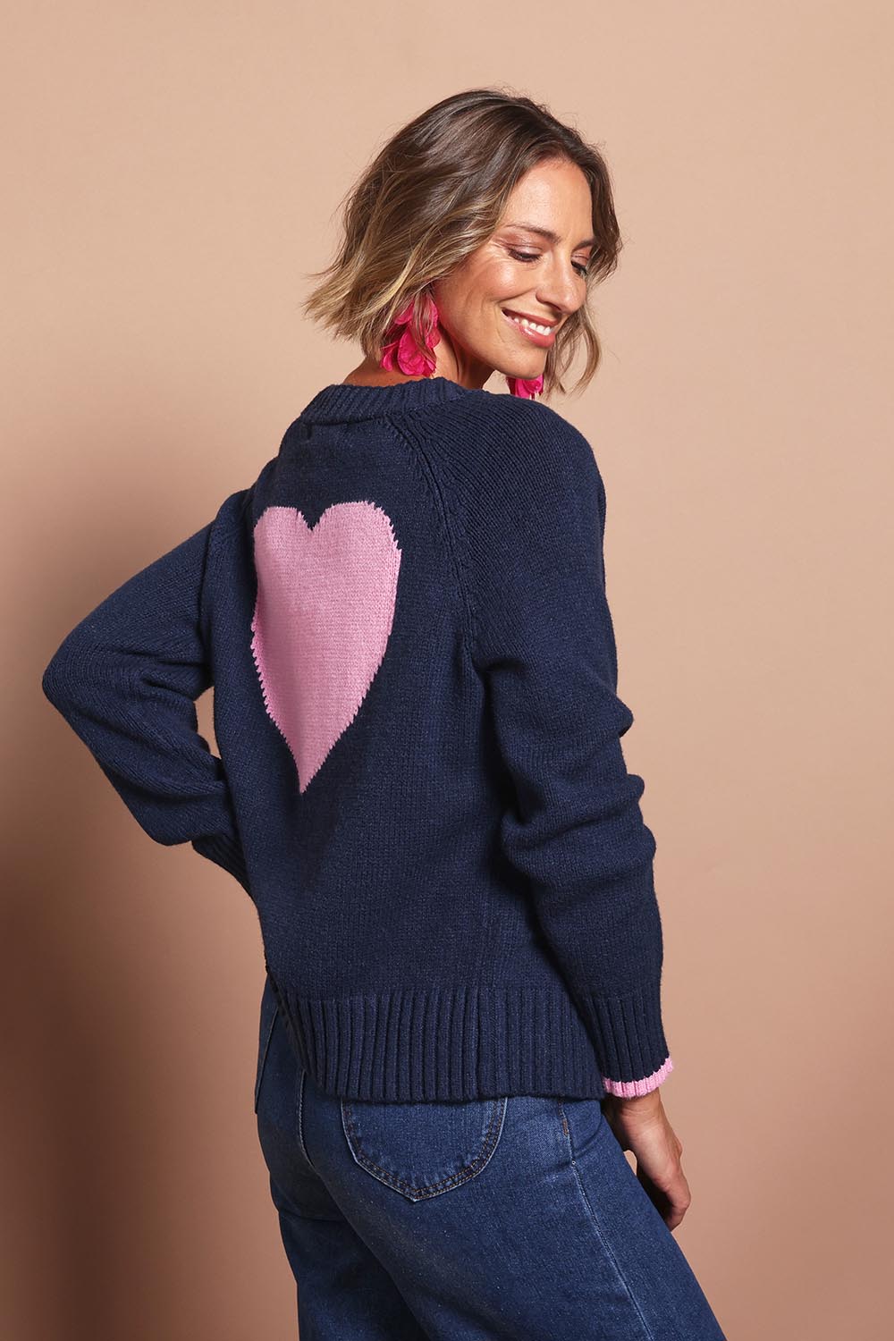 Model Riina wearing size S of the Back To Love Cardi in colour Navy (Blue), from the front, cropped image