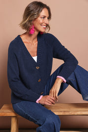 Model Riina wearing size S of the Back To Love Cardi in colour Navy (Blue), from the front, cropped image