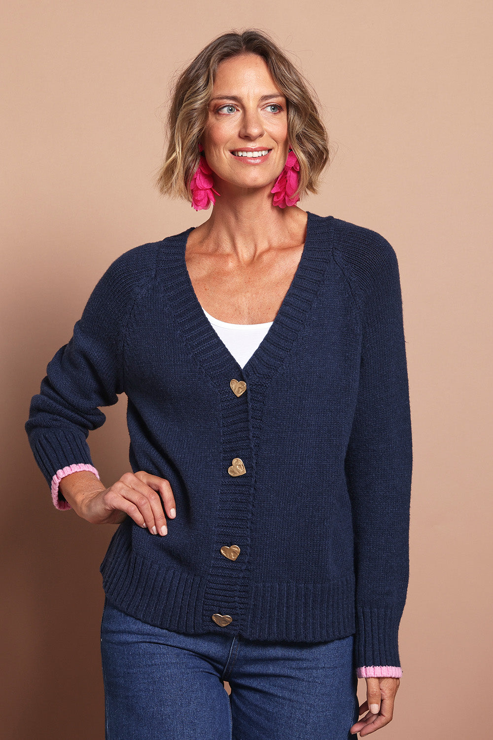Model Riina wearing size S of the Back To Love Cardi in colour Navy (Blue), from the front, cropped image