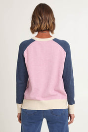 Model Riina wearing size S of the Rosie Knit in colour Pink (Pink), from the back