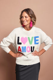 Model Riina wearing size S of the Love Amour Knit in colour Natural, from the front, cropped image