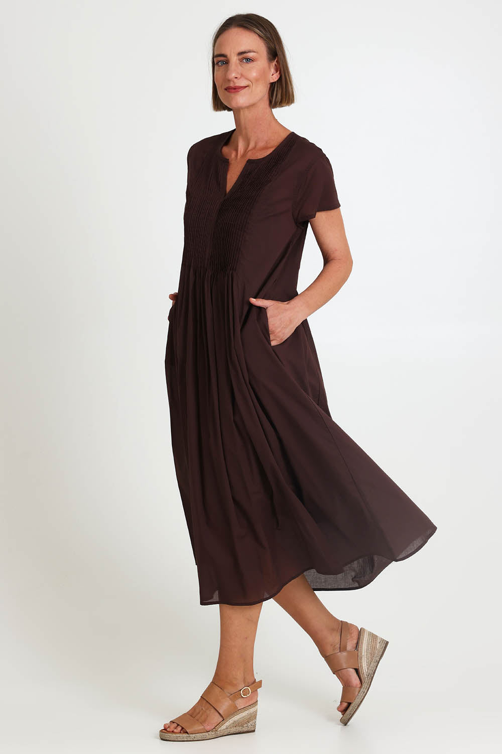 Model Riinar wearing size 10 of the Acacia Cotton Dress – Coffee in colour Coffee, from the front