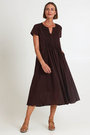Model Riinar wearing size 10 of the Acacia Cotton Dress – Coffee in colour Coffee, from the front