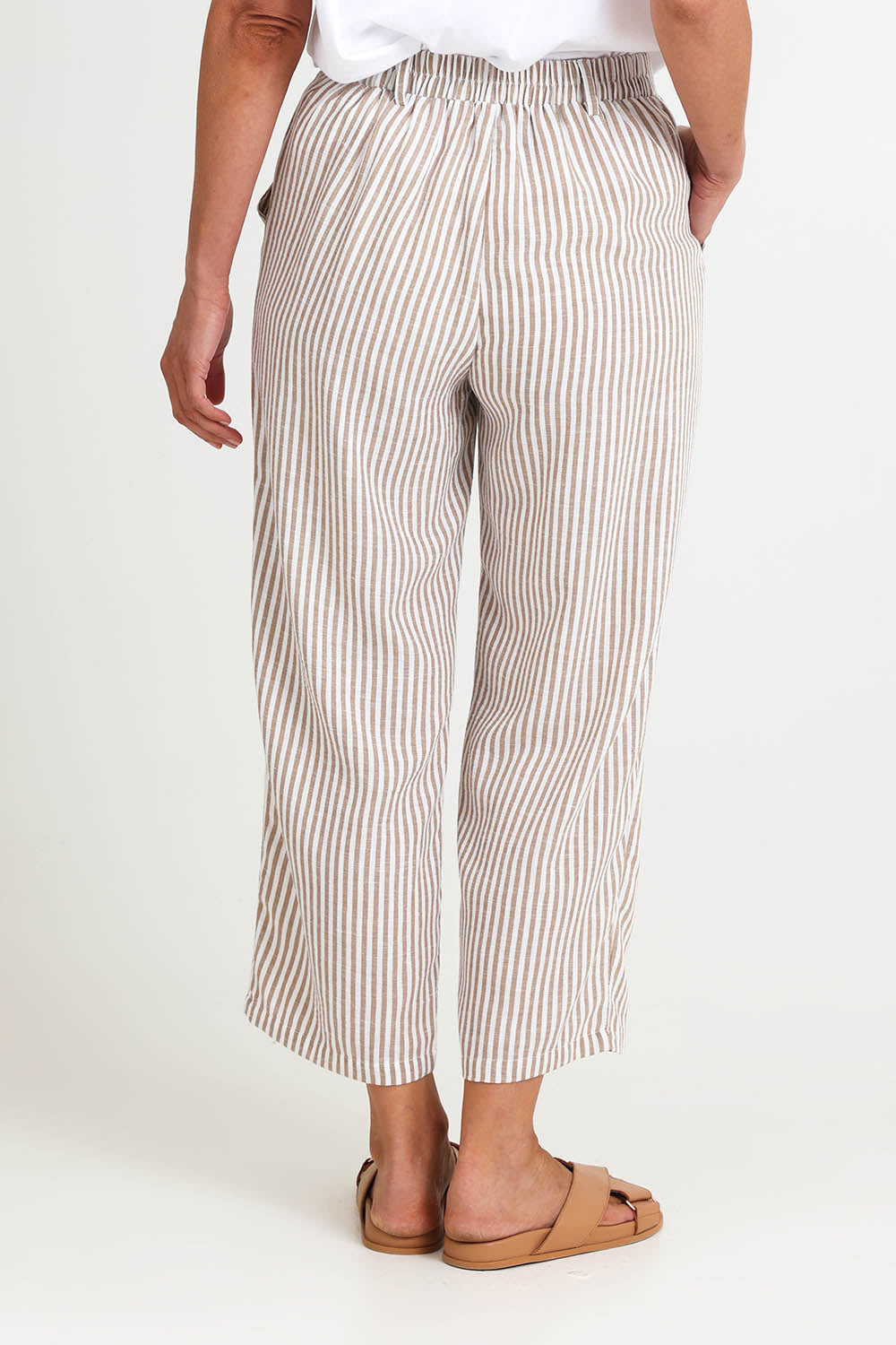 Model Riinar wearing size 10 of the Urban Stripe Pant – Natural in colour Natural, from the back