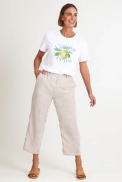 Model Riinar wearing size 10 of the Urban Stripe Pant – Natural in colour Natural, from the front