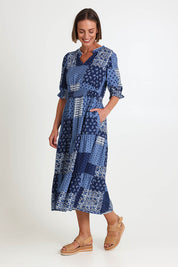 Model Riinar wearing size 10 of the Costa Mesa Print Dress – Navy in colour Navy, from the front