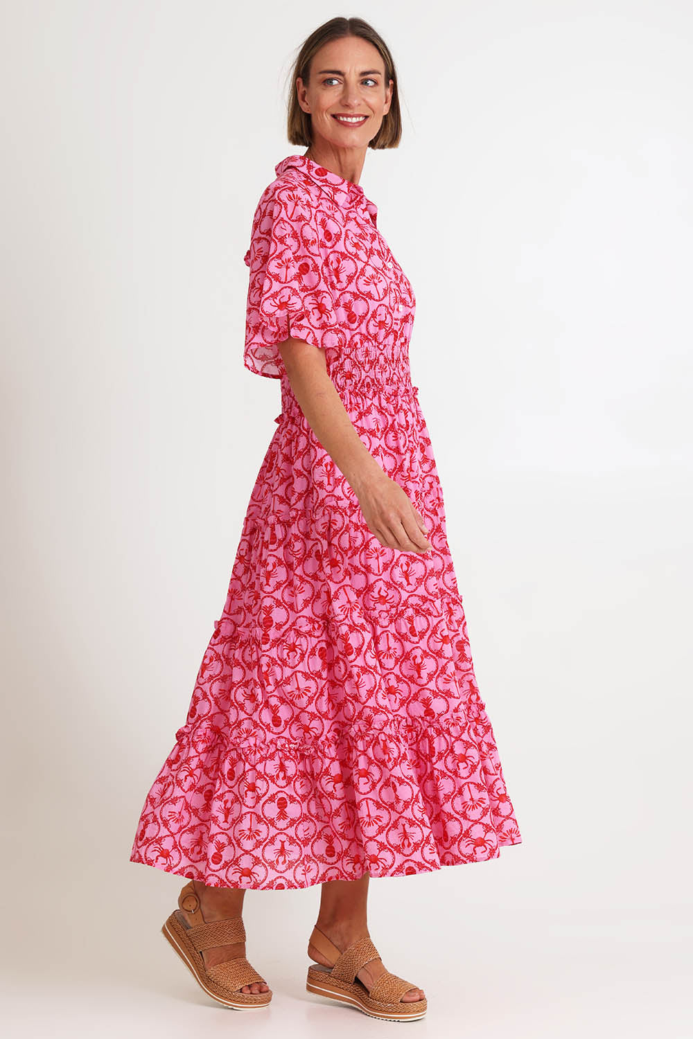 Model Riinar wearing size 10 of the Laguna Beach Print Dress – Rose in colour Rose, from the front
