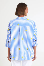 Model Riinar wearing size 10 of the Spritz Stripe Shirt – Bluewhite in colour Bluewhite, from the back