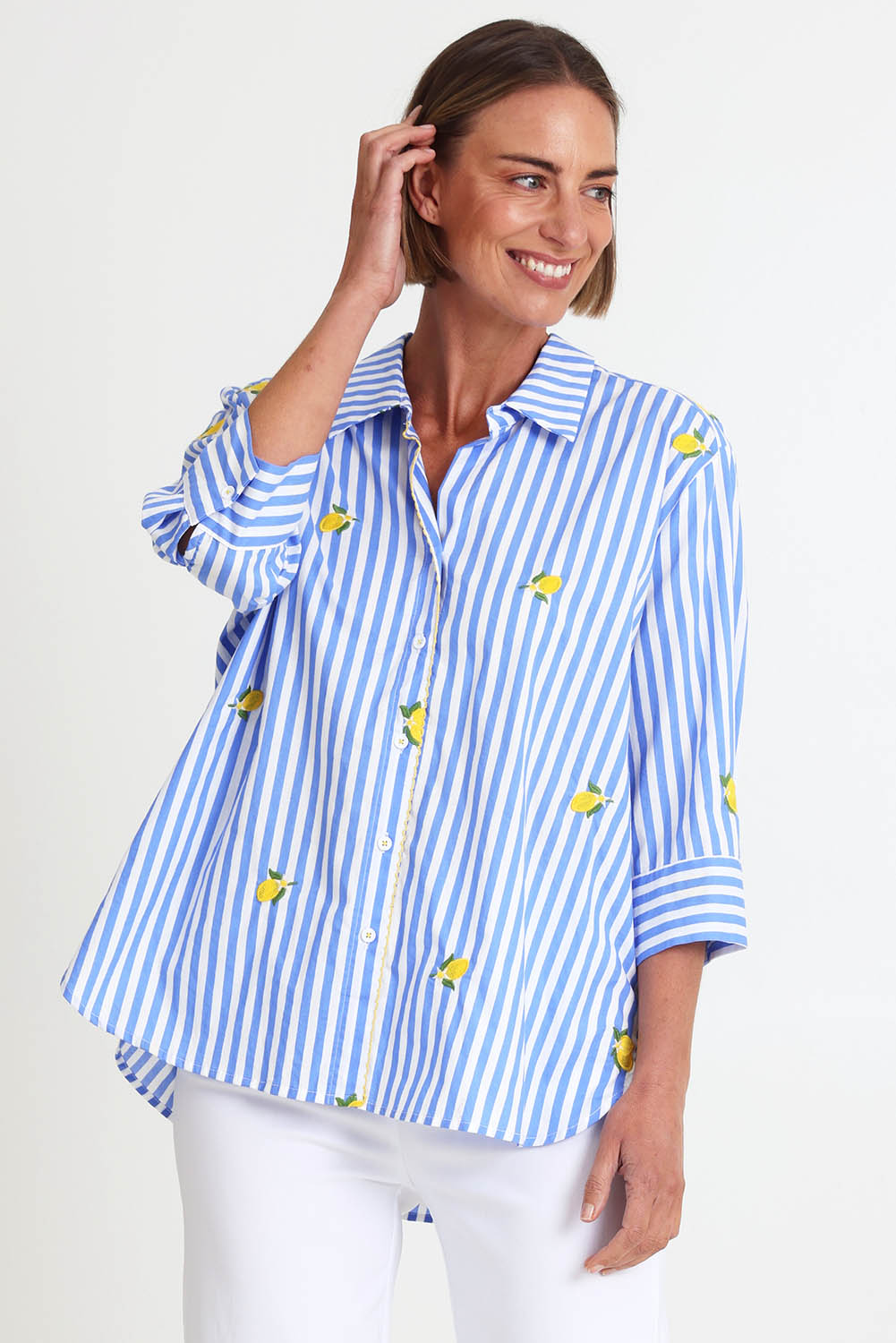 Model Riinar wearing size 10 of the Spritz Stripe Shirt – Bluewhite in colour Bluewhite, in a cropped view