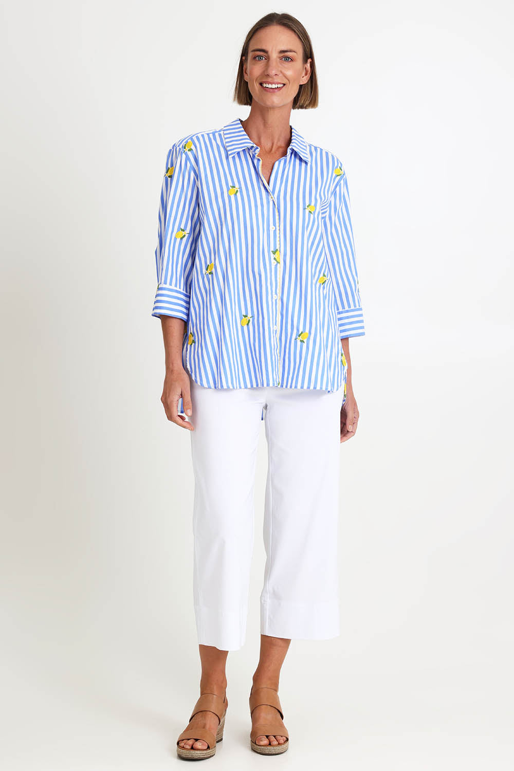 Model Riinar wearing size 10 of the Spritz Stripe Shirt – Bluewhite in colour Bluewhite, from the front