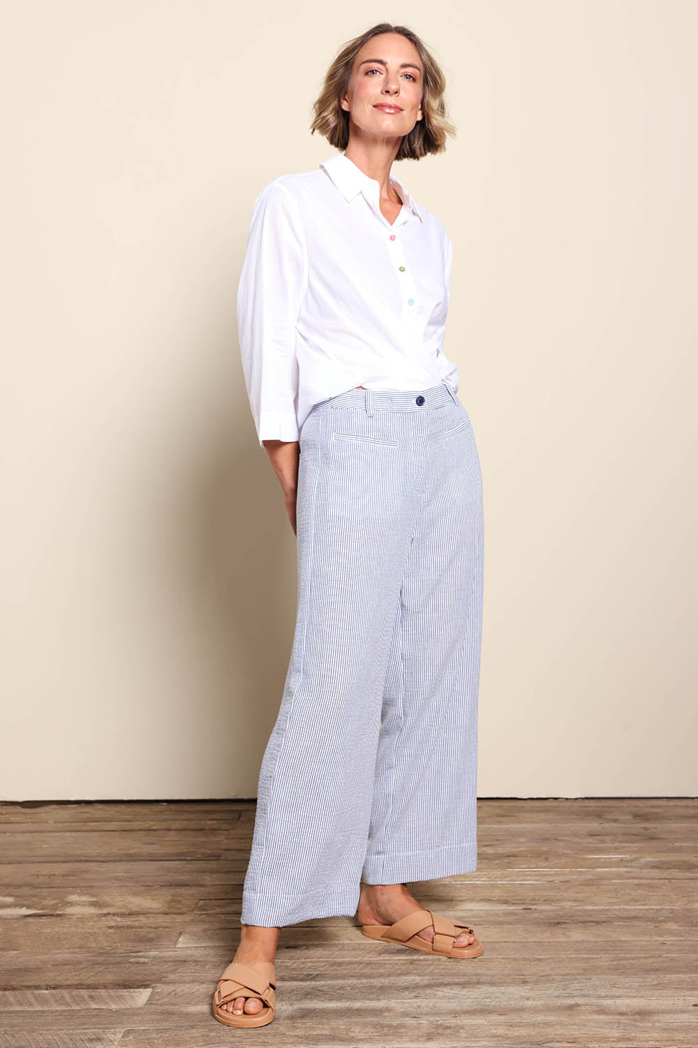 Model Riinar wearing size 10 of the City Stripe Pant - Navywhite in colour Navywhite, from the front