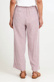 Model Riinar wearing size 10 of the City Stripe Pant - Redwhite in colour Redwhite, from the back