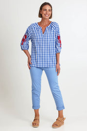 Model Riinar wearing size 10 of the Cove Check Top – Azure in colour Azure, from the front