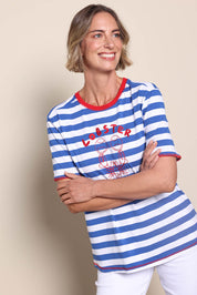 Model Riinar wearing size 10 of the Rhode Island Stripe Tee – Azure in colour Azure, from an angle