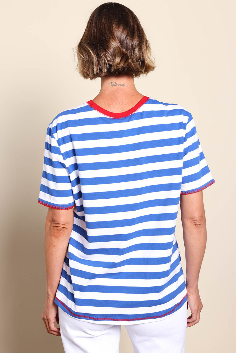 Model Riinar wearing size 10 of the Rhode Island Stripe Tee – Azure in colour Azure, from the back