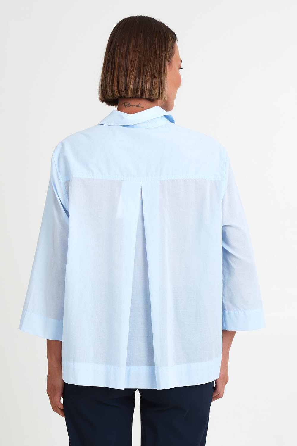 Model Riinar wearing size 10 of the Costa Mesa Cotton Shirt - Paleblue in colour Paleblue, from the back