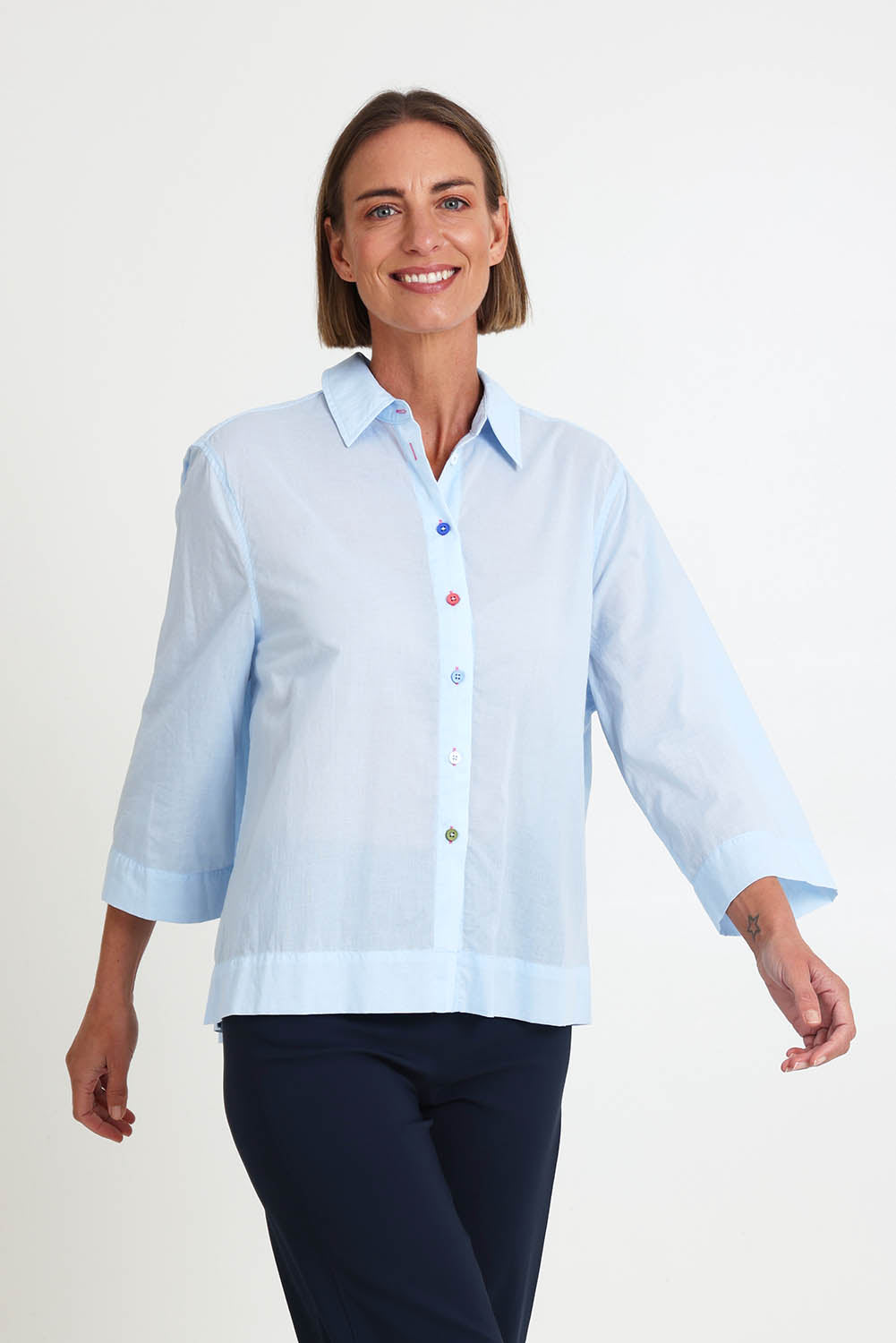 Model Riinar wearing size 10 of the Costa Mesa Cotton Shirt - Paleblue in colour Paleblue, in a cropped view