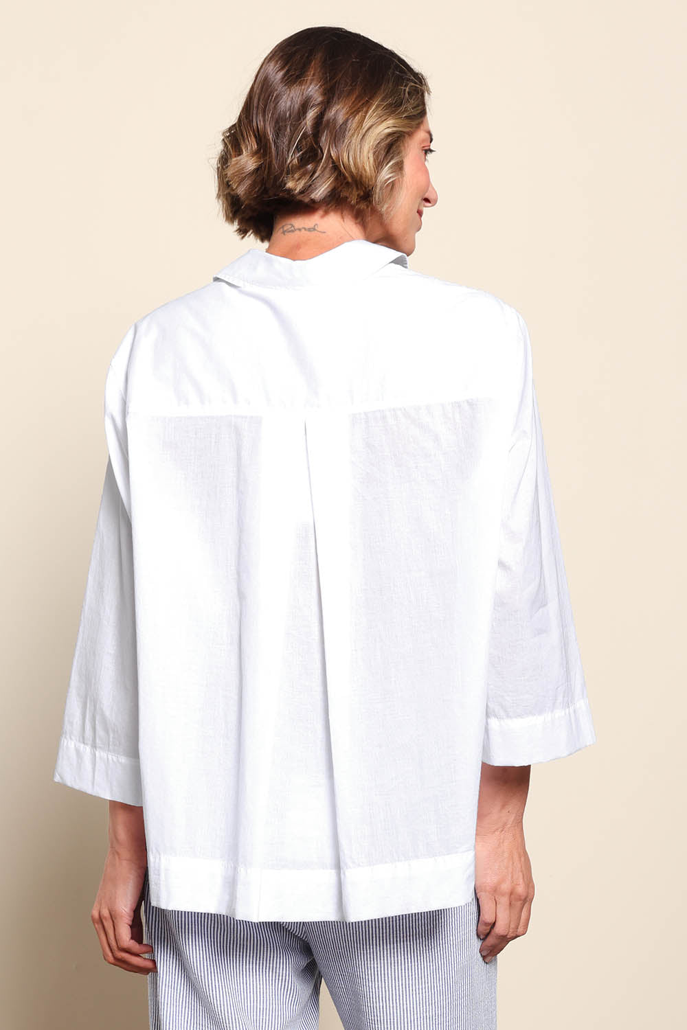 Model Riinar wearing size 10 of the Costa Mesa Cotton Shirt - White in colour White, from the back