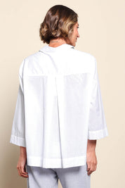 Model Riinar wearing size 10 of the Costa Mesa Cotton Shirt - White in colour White, from the back