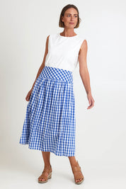 Model Riinar wearing size 10 of the Amalfi Check Skirt – Azure in colour Azure, from the front