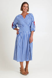Model Riinar wearing size 10 of the Amalfi Check Skirt – Azure in colour Azure, from the front