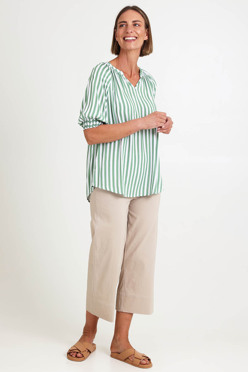 Model Riinar wearing size 10 of the Kalahari Stripe Top – Apple in colour Apple, from the front