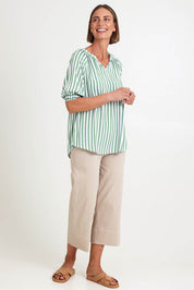 Model Riinar wearing size 10 of the Kalahari Stripe Top – Apple in colour Apple, from the front