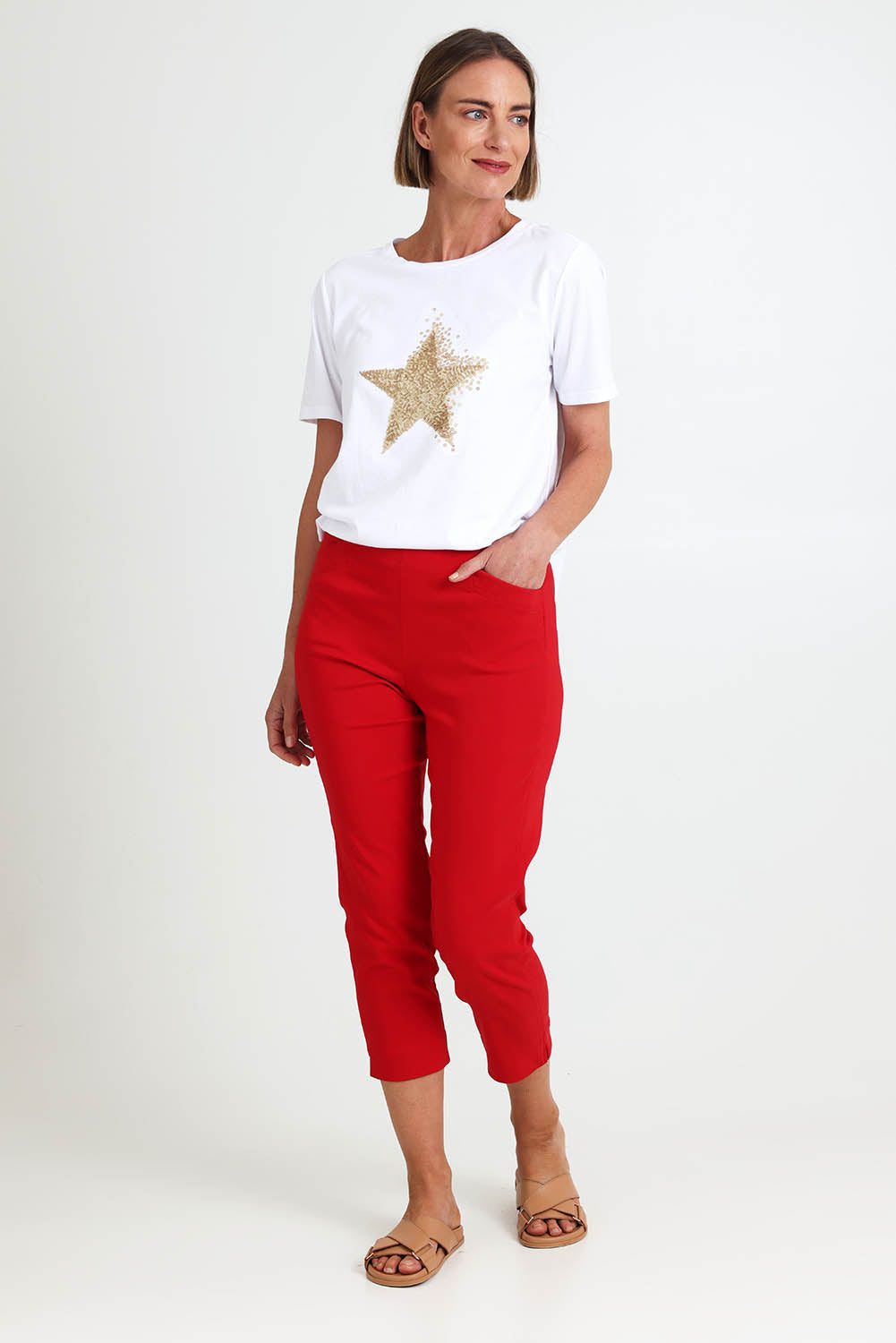 Model Riinar wearing size 10 of the Zara Pant - Red in colour Red, from the front