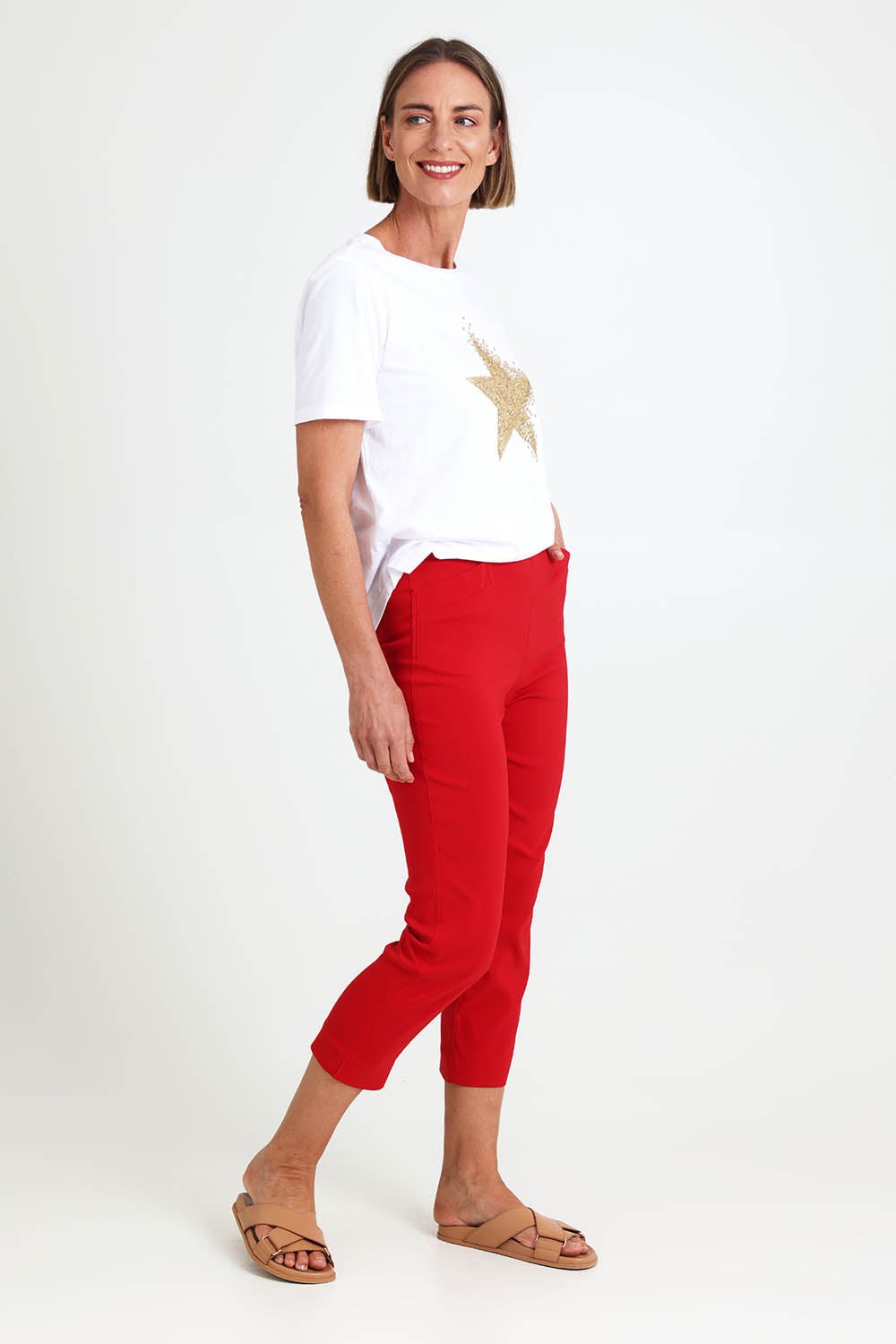 Model Riinar wearing size 10 of the Zara Pant - Red in colour Red, from the front