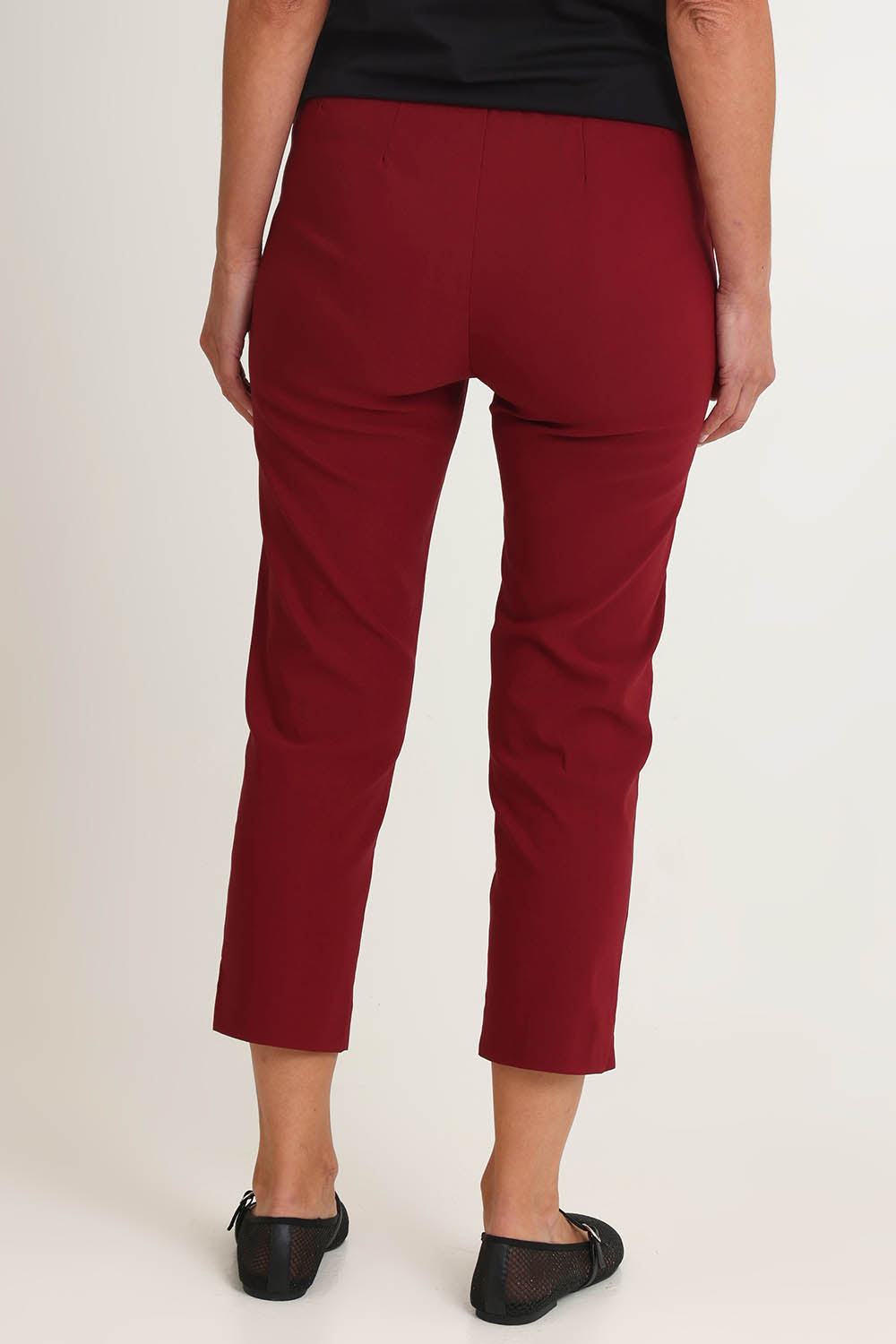 Model Riina wearing size S of the Zara Pant in colour Shiraz (Red), from the back
