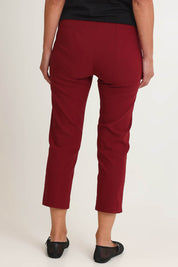 Model Riina wearing size S of the Zara Pant in colour Shiraz (Red), from the back