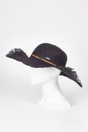 A model wearing size OneSize of the Portofino Wide Brim Capeline in colour Blacktan (Black), from the front, showing the whole outfit