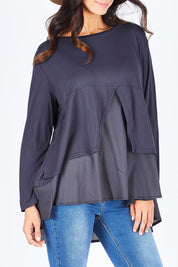 Model Gemma wearing size S of the Triangle Detail Long Sleeve Tee in colour Navy (Blue), from the front, cropped image