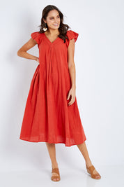 Model Elhana wearing size S of the Vin colourNeck Maxi Dress - Guava (Red), from the front, showing the whole outfit
