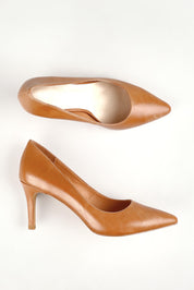 A model wearing size 36 of the Barrios Leather Heel in colour Tanleath, from the front, showing the whole outfit